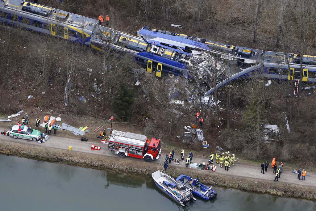 Aerial view of rescue workers at the site where two trains collided head-on near Bad Aibling, Germany, Tuesday, Feb. 9, 2016. Several people have been killed and dozens were injured. (AP Photo/Matthias Schrader)